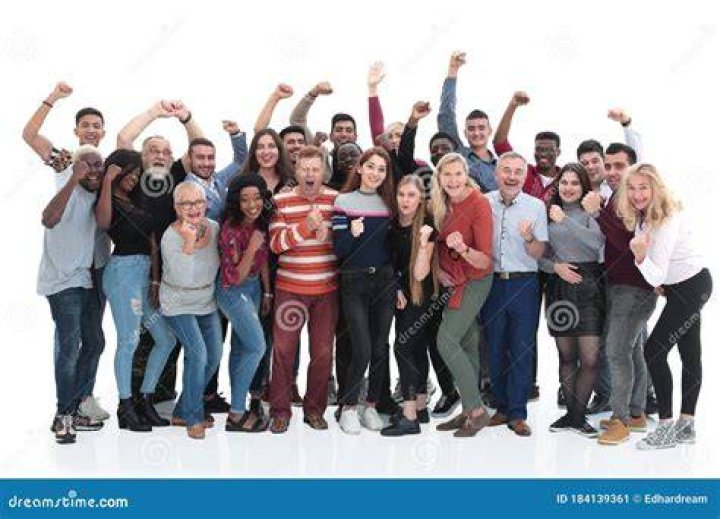 a group of people standing next to each other in front of a wood