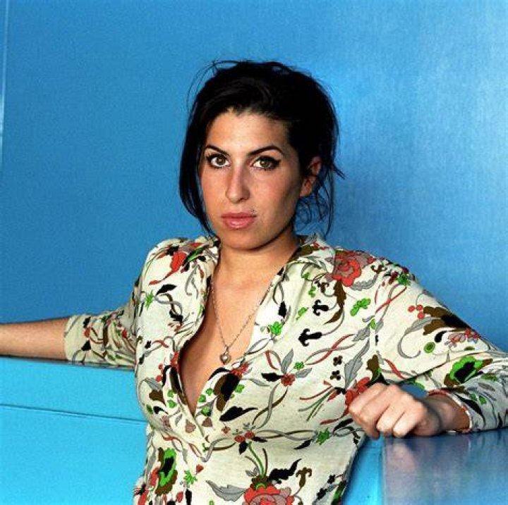 Amy Winehouse's exhusband says he 'cashed in' on her life after she