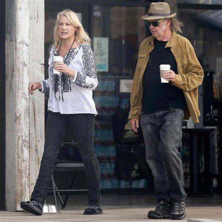 Neil Young and Daryl Hannah cozy up one month after announcing divorce