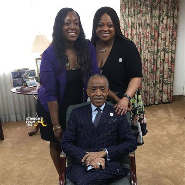 Rev. Al Sharpton and daughters Ashley (left) and Dominique pose for