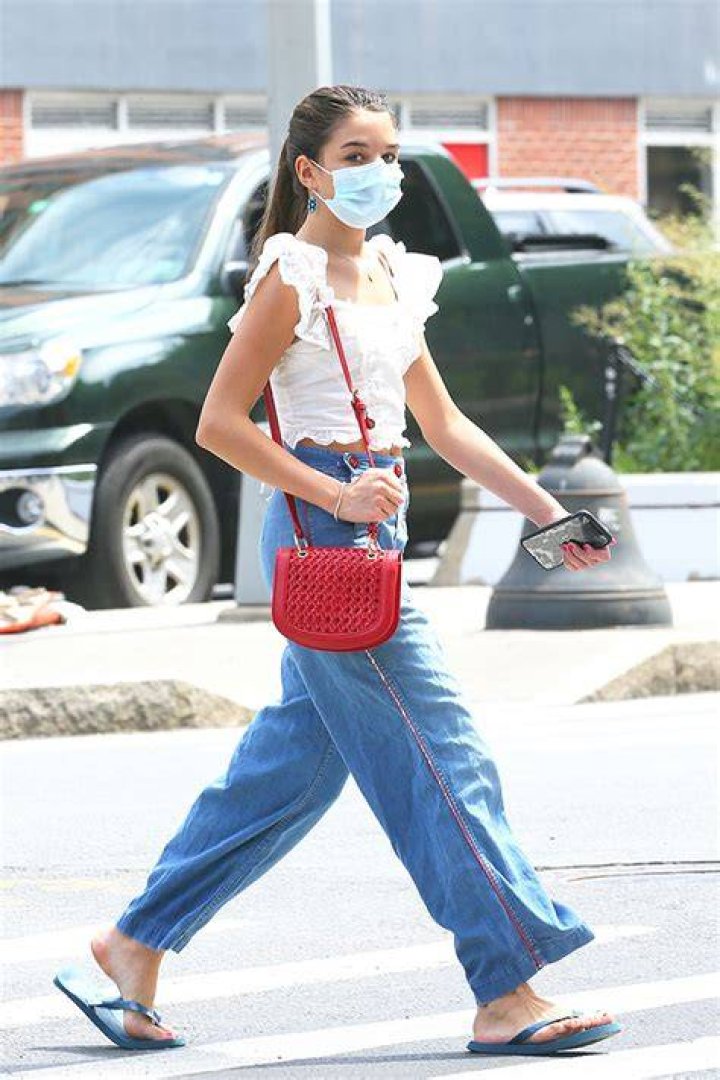 Suri Cruise, 14, looks nearly as tall as mom Katie Holmes … as the pair