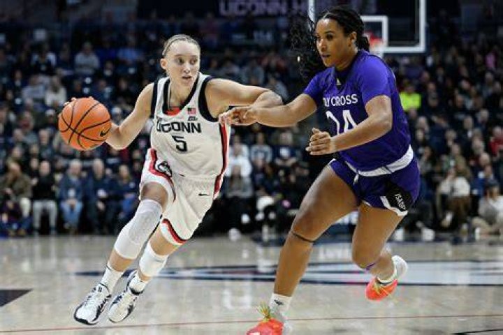 UConn star Paige Bueckers helped off the court after going down with